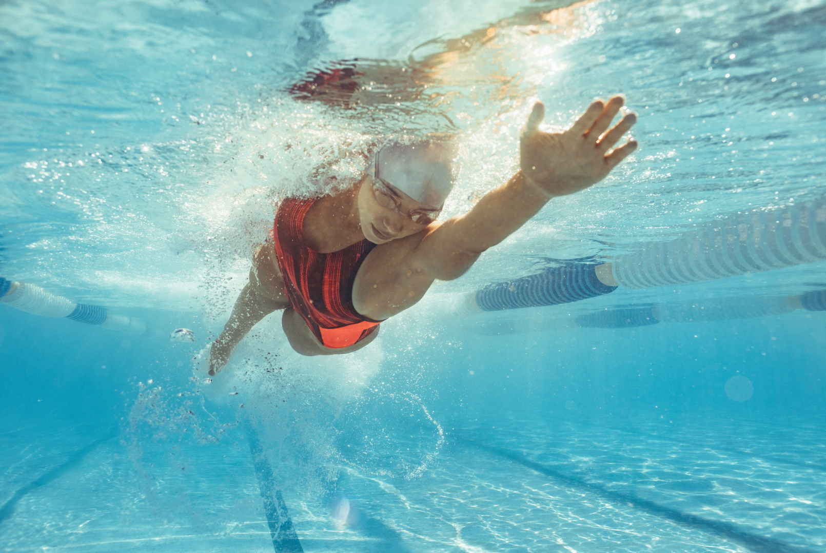 Competitive swimmer underwater in a pool