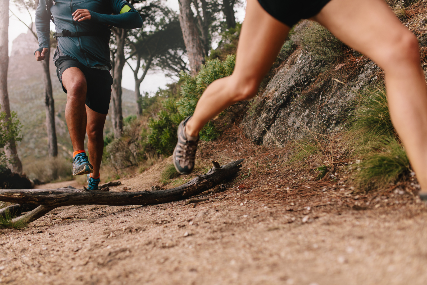 Trail runners navigating uneven terrain